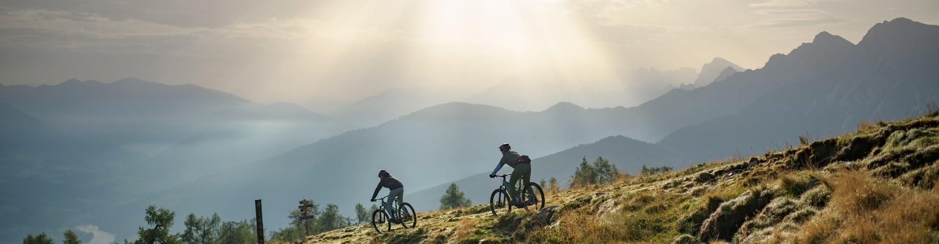 cube full suspension electric mountain bike riding down mountain trails